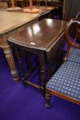 A traditional oak gate leg dining table