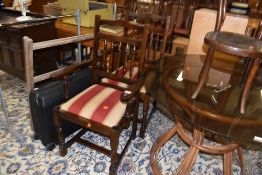 A pair of hard wood framed carver chairs having striped upholstery