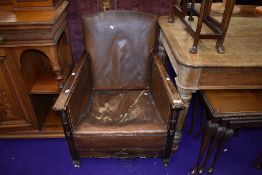 An early 20th Century oak framed armchair with leather upholstery (restoration project)
