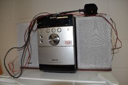 A Sony CMT - EH15 hifi unit with speakers