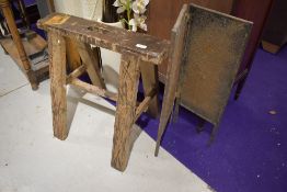 A trestle and copper fire screen