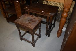 A nest of priory style oak side tables
