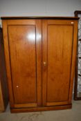 A late Victorian/Edwardian pine double wardrobe having drawer set to base good simple design