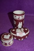 Three pieces of Jasper ware in a plum ground having Wedgwood stamp to base