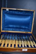A cased canteen of fish forks and knives in a cutlery set