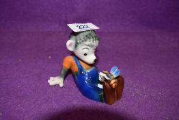 A mid century pottery figure by Goebel hedgehog sat with butterfly