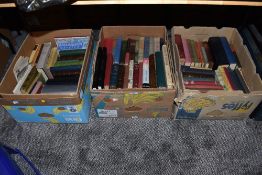 A selection of text and reference books over three boxes