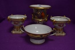 A mid Victorian highly decorated mantle set including Traveller gypsy painted urn and pair of