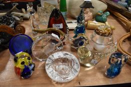 A selection of art glass and similar studio glass paper weights including Wedgwood penguin