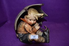 A mid century figure by Hummel Goebel Umbrella Boy in good condition