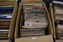 A selection of vinyl records and albums including pop and rock interest