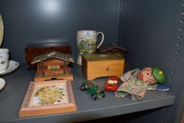 A selection of musical jewellery boxes and ceramic headed puppet