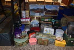 A selection of printed advertising tins and similar cases