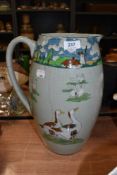 a large hand decorated early 20th century water jug depicting country and goose scenes AF