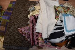 A collection of vintage headscarves and shawls, including Welsh style wool shawl and fringed