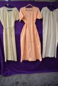 Three vintage nightgowns, two wool and one cotton.