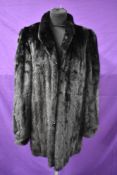 A mid length vintage black mink coat.