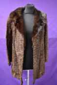 A vintage Swakara south west African Karakul Lamb coat in brown with mink collar.