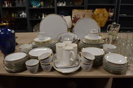 A large part tea and dinner service comprising of several different makers all in a white and gilt