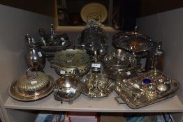 A large amount of plated table and dinner ware serving items including pewter and cake stand