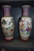 Two substantial floor standing Chinese export hard paste vase having Cantonese styled palette one