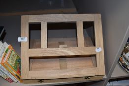 A collection of books and a book rest, including Annuals and childrens books, vintage and modern.