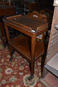 An early 20th Century oak two tier tea trolley, dimensions approx. 61 x 40 x 82cm