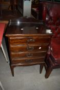 An early 20th Century stained frame 4 drawer music cabinet, damage to top handle
