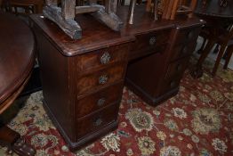 A late Victorian mahogany knee hole desk or dressing table, having later handles, width approx.