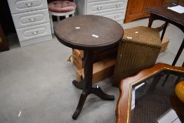An oak pedestal table having twist column and triple splay legs, diameter approx. 43cm