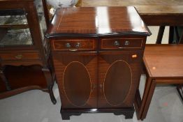 A reproduction Regency style mahogany and inlay enclosed hifi cabinet/cupboard, having serpentine