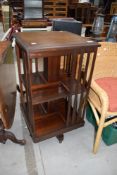 An early 20th Century mahogany and inlaid revolving bookcase