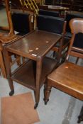 An early to mid 20th Century oak tea trolley