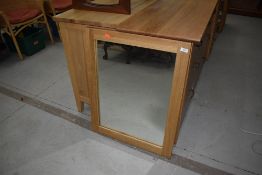 A modern golden oak wall mirror, fixings orientated as portrait, approx 60 x 75cm