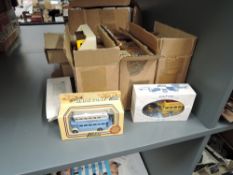 A collection of 33 Lledo Days Gone and similar diecasts, all in window display boxes