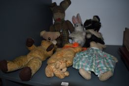 A 1930's Chad Valley straw filled yellow plush bear having replacement plastic eyes, stitched nose ,
