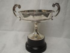 An Edwardian silver Military trophy having moulded loop handles and column pedestal, bearing