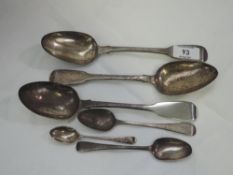 A pair of Georgian silver tablespoons of fiddle back form bearing initial M to terminals, London
