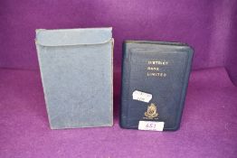 A vintage District bank limited penny saving money box with original case