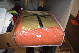 A retro bed throw/quilt in terracotta/orange, thought to be king sized, unused in original
