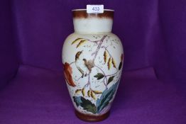 An opal glass vase with hand painted scenes of nature and Wren bird