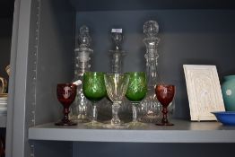 A lot containing three vintage decanters and an assortment of glasses including red and green
