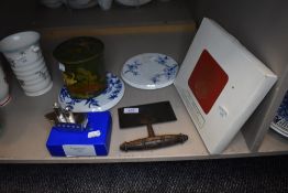 A selection of kitchen wares including teapot stands and herb cutter