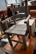 A garden armchair having ladderback