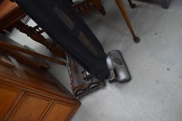A vintage Ewebank cleaner and an early electric junior hoover