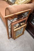 A selection of decorative mirrors and print