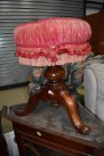 A Victorian mahogany framed piano stool having woolwork seat