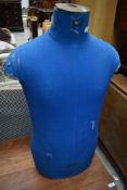 A vintage tailors or dress makers dummy having blue cover by Cleo