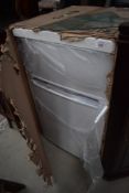 A new old stock Curry Essentials 48cm Fridge Freezer , still packaged, opened front only to check