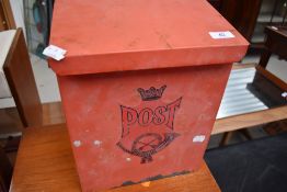 A wall mounted metal post box